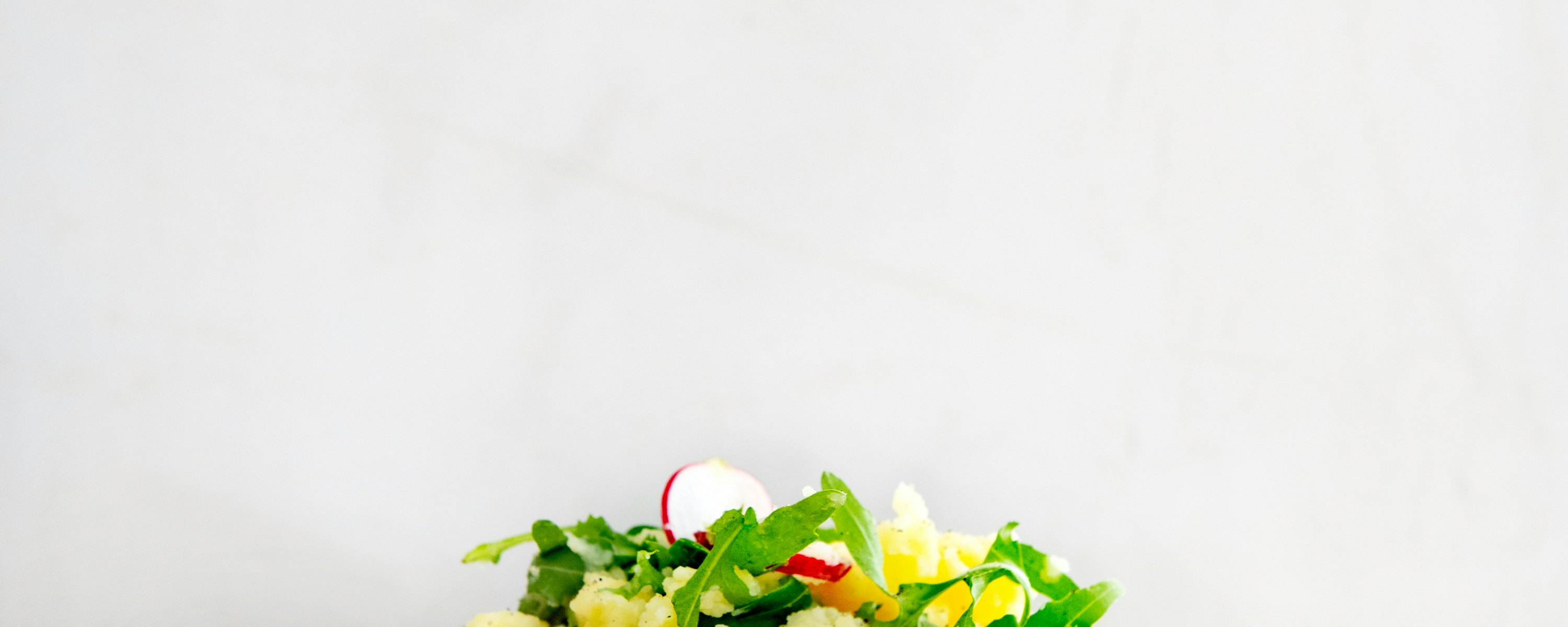 Rucolastamppot met radijs en gebakken worst